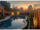 Wonderful backyard pool and hot tub area, highlighted by a colorful sunset at 3904 E Carter Dr, Phoenix, AZ 85042