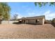 Spacious backyard featuring a covered patio and a desert landscape at 40144 N Lerwick Dr, San Tan Valley, AZ 85140