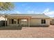 Backyard showcasing a covered patio and a low-maintenance desert landscape at 40144 N Lerwick Dr, San Tan Valley, AZ 85140