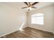 Cozy bedroom with a ceiling fan and hardwood floors, providing a comfortable and stylish living space at 40144 N Lerwick Dr, San Tan Valley, AZ 85140