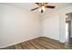 Bedroom featuring new floors, ceiling fan and a closet with sliding doors at 40144 N Lerwick Dr, San Tan Valley, AZ 85140