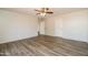 Bright bedroom with a ceiling fan and light hardwood floors, offering a clean and inviting space at 40144 N Lerwick Dr, San Tan Valley, AZ 85140