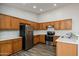 Well-lit kitchen with stainless steel appliances, oak cabinets, and white countertops at 40144 N Lerwick Dr, San Tan Valley, AZ 85140