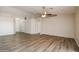 An open concept living room with light neutral walls and wood-look floors at 40144 N Lerwick Dr, San Tan Valley, AZ 85140