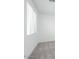 Neutral-toned bedroom with gray carpet and large window with blinds at 40250 N Alegre Dr, San Tan Valley, AZ 85140