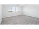 Bright bedroom with large windows and plush gray carpeting at 40250 N Alegre Dr, San Tan Valley, AZ 85140