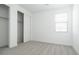 Bright bedroom features neutral carpet, closet with sliding door, and window at 40250 N Alegre Dr, San Tan Valley, AZ 85140
