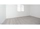 Light-filled bedroom boasts soft carpet and a bright window at 40250 N Alegre Dr, San Tan Valley, AZ 85140