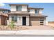 Two-story home featuring neutral stucco, two-car garage, tile roof and low maintenance landscaping at 40250 N Alegre Dr, San Tan Valley, AZ 85140