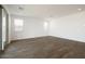 Bright living room with wood tile flooring and modern recessed lighting at 40250 N Alegre Dr, San Tan Valley, AZ 85140