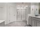 Well-lit bathroom featuring a glass shower, white cabinets, and wood-look tile flooring at 4116 E Roy Rogers Rd, Cave Creek, AZ 85331