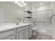 Bright bathroom featuring a white vanity, tiled shower-tub, and modern fixtures at 4116 E Roy Rogers Rd, Cave Creek, AZ 85331