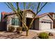 Inviting exterior view of a home with a stone-accented entrance and low-maintenance landscaping at 4116 E Roy Rogers Rd, Cave Creek, AZ 85331