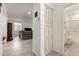 Bright hallway featuring tile floors, storage, leading to a living space and a bathroom at 4116 E Roy Rogers Rd, Cave Creek, AZ 85331