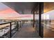 Spacious balcony features glass railings and panoramic views, creating an ideal outdoor relaxation and entertainment space at 4422 N 75Th St # 8005, Scottsdale, AZ 85251