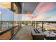 A modern balcony with a fire pit and gorgeous sunset views over the city at 4422 N 75Th St # 8005, Scottsdale, AZ 85251