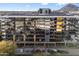 Contemporary condo building featuring private balconies with a city view at 4422 N 75Th St # 8005, Scottsdale, AZ 85251