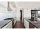 Modern kitchen with white cabinetry, stainless steel appliances, and a large center island at 4422 N 75Th St # 8005, Scottsdale, AZ 85251