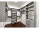 Organized walk-in closet with custom shelving and ample hanging space provides generous storage solutions at 4422 N 75Th St # 8005, Scottsdale, AZ 85251