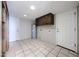 Basement with tile flooring, water heater, and white doors, offering ample storage space at 4523 W Bluefield Ave, Glendale, AZ 85308