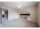 Bedroom featuring neutral walls and carpet, a ceiling fan, and an open archway to the downstairs area at 4523 W Bluefield Ave, Glendale, AZ 85308