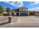 Charming two-story home featuring a blue garage door and mailbox in a beautiful neighborhood at 4523 W Bluefield Ave, Glendale, AZ 85308