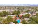 Aerial view of condo community with a pool and well-maintained landscaping at 4704 E Paradise Village Pkwy # 213, Phoenix, AZ 85032