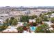 Panoramic aerial view showcases community near shopping, construction, mountains, with a pool and green trees at 4704 E Paradise Village Pkwy # 213, Phoenix, AZ 85032