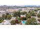 Condominium community and construction site in an aerial view featuring a sparkling community pool at 4704 E Paradise Village Pkwy # 213, Phoenix, AZ 85032