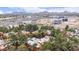 Expansive aerial view of condo community, showcasing lush trees and an overview of nearby amenities at 4704 E Paradise Village Pkwy # 213, Phoenix, AZ 85032