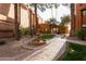 Courtyard featuring a fountain, trees and green grass at 4704 E Paradise Village Pkwy # 213, Phoenix, AZ 85032