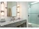 Bright bathroom with stylish lighting, marble vanity, and glass-enclosed shower at 5101 N Casa Blanca Dr # 217, Paradise Valley, AZ 85253