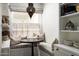 Cozy breakfast nook with upholstered bench seating, a pendant light, and built-in shelving at 5101 N Casa Blanca Dr # 217, Paradise Valley, AZ 85253