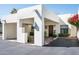 Modern home featuring two-car garage, covered porch and lovely desert landscaping at 5101 N Casa Blanca Dr # 217, Paradise Valley, AZ 85253