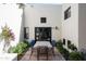 Inviting patio featuring outdoor dining, bright bougainvillea, and desert landscaping at 5101 N Casa Blanca Dr # 217, Paradise Valley, AZ 85253