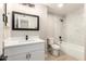 This bathroom features a vanity, tile shower, and updated fixtures at 5208 W Earll Dr, Phoenix, AZ 85031