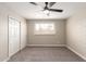 Bright bedroom featuring a ceiling fan, a closet, and natural light at 5208 W Earll Dr, Phoenix, AZ 85031