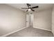 Bright bedroom with a ceiling fan and neutral tones at 5208 W Earll Dr, Phoenix, AZ 85031