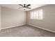 Bedroom featuring a ceiling fan, natural light and brick walls at 5208 W Earll Dr, Phoenix, AZ 85031