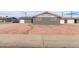 Charming home with gray brick exterior and low maintenance rock front yard at 5208 W Earll Dr, Phoenix, AZ 85031