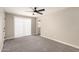 Neutral toned living room featuring a modern ceiling fan, and white trim at 5208 W Earll Dr, Phoenix, AZ 85031