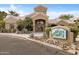 Community clubhouse with mature landscaping and monument sign at 5335 E Shea Blvd # 2022, Scottsdale, AZ 85254