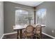 Bright dining area with modern lighting and a wood table offering a cozy and inviting space for Gathering meals at 5335 E Shea Blvd # 2022, Scottsdale, AZ 85254