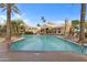 Resort style pool with beautiful clubhouse and palm trees in residential community at 5335 E Shea Blvd # 2022, Scottsdale, AZ 85254