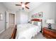 Comfortable bedroom featuring a neutral color scheme, carpet, and a bed with decorative pillows at 5621 N 189Th Dr, Litchfield Park, AZ 85340