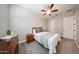 This bedroom features carpet, a ceiling fan, and standard bedroom furniture at 5621 N 189Th Dr, Litchfield Park, AZ 85340