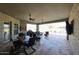 Covered patio with ceiling fans and outdoor furniture with a view of the pool at 5621 N 189Th Dr, Litchfield Park, AZ 85340