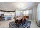 An open concept dining area features a wooden table, seating for six and easy access to kitchen at 5621 N 189Th Dr, Litchfield Park, AZ 85340