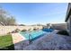 Backyard view of a private swimming pool with stone decking at 5621 N 189Th Dr, Litchfield Park, AZ 85340