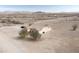 Aerial view of the home, revealing vast desert landscape and privacy at 6431 N 418Th Ave, Tonopah, AZ 85354